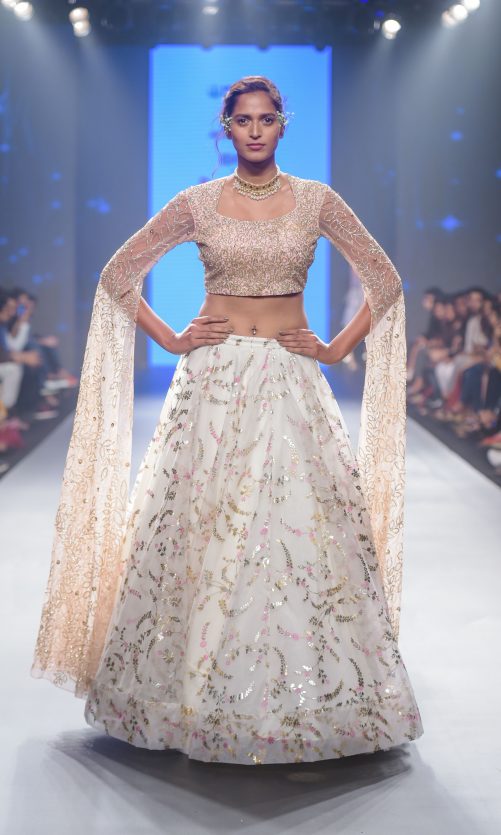 White Lehenga With Floor Length Sleeve Blouse